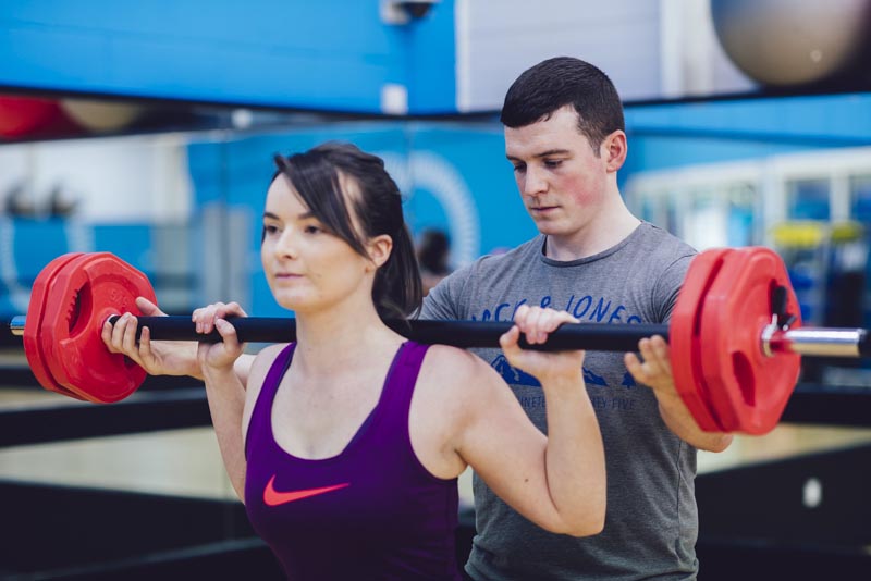 Conor Helping Client With Exercise