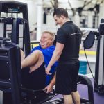 Conor Helping Client With Exercise